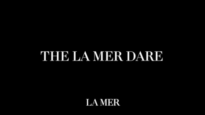 Black background with white sans-serif text displaying 'THE LA MER DARE' and 'LA MER' in a minimalist composition.