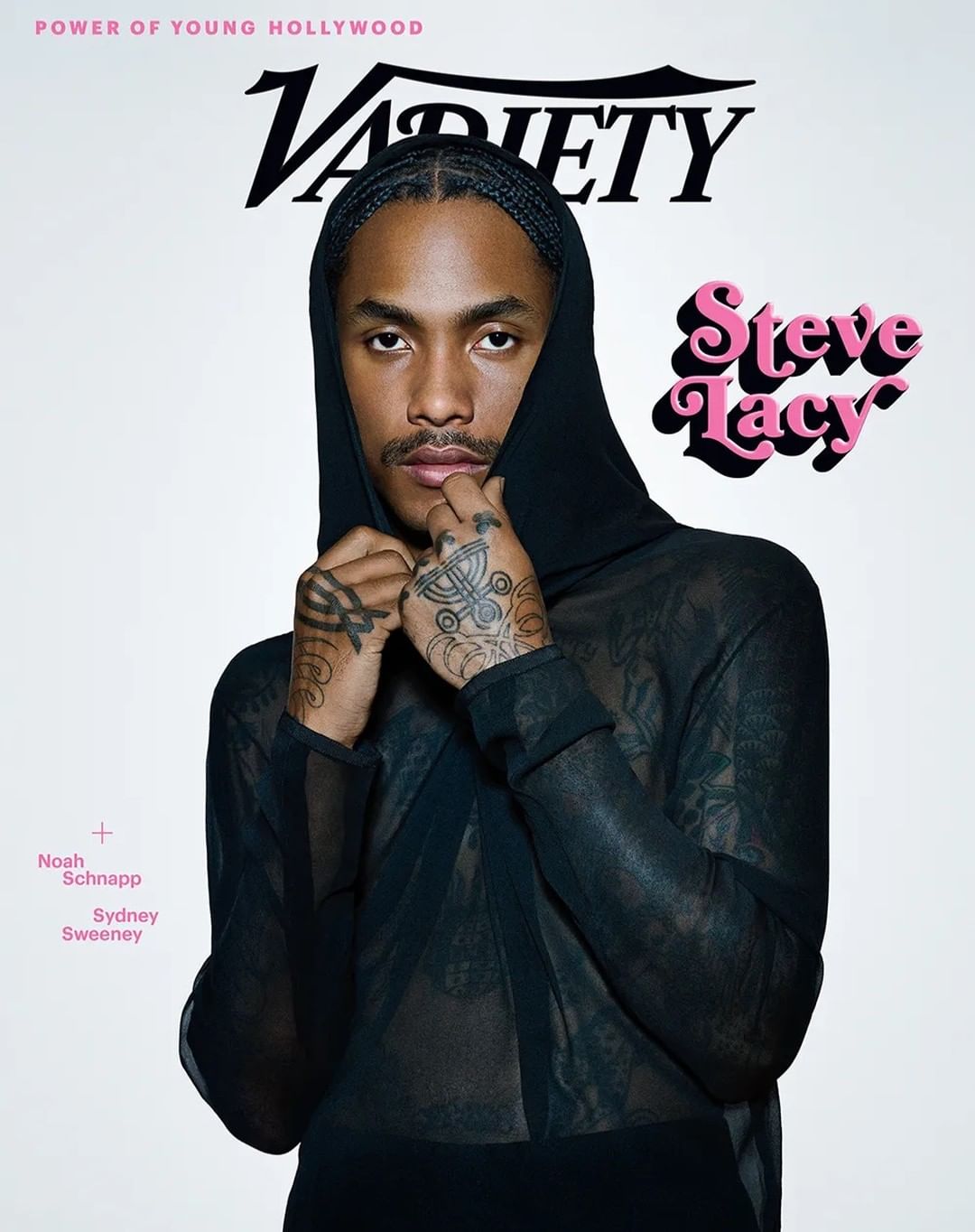 Steve Lacy on Variety magazine cover with a black hooded sheer shirt and tattoos, set against a white background.