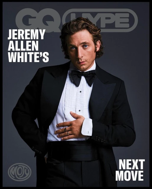 Jeremy Allen White poses in a tuxedo for a GQ magazine cover, showcasing a classic formal look against a dark grey background with visible text.