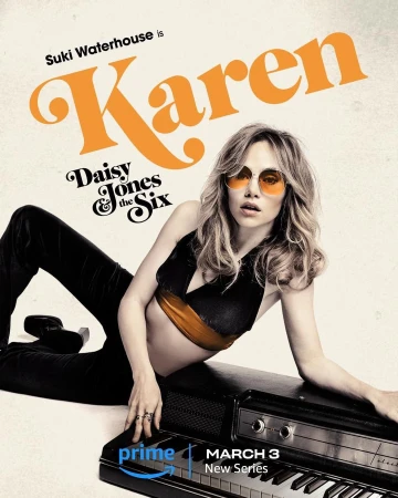 Suki Waterhouse as Karen in Daisy Jones & The Six new series, laying on a piano wearing sunglasses, black top and pants.