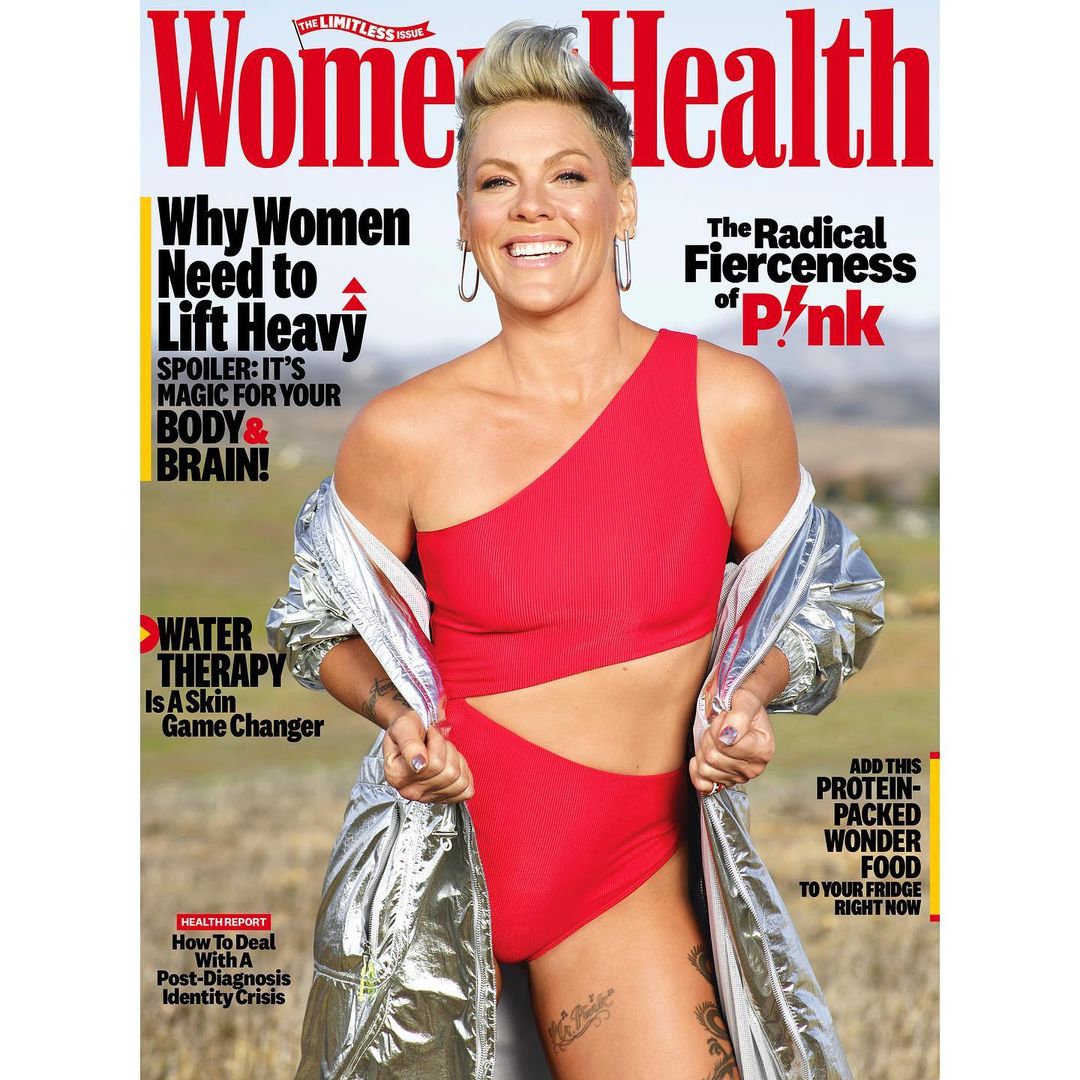 Women's Health magazine cover featuring Pink in a red swimsuit, silver jacket, with motivational health headlines against a natural background.