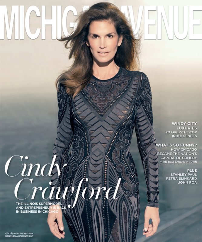 Cindy Crawford graces the cover of Michigan Avenue magazine, wearing a long-sleeved gray dress with patterned details, showcasing editorial fashion.