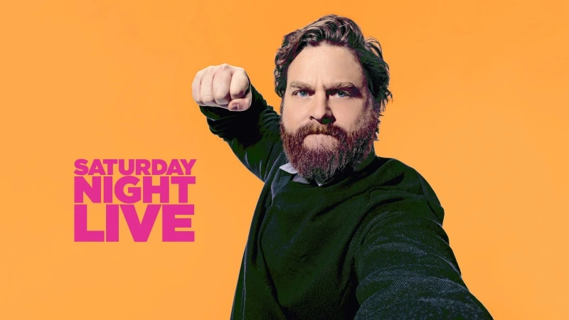 Zach Galifianakis strikes a comedic pose in an SNL promo image with an orange backdrop and the Saturday Night Live logo.