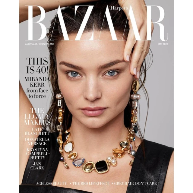 Magazine cover featuring Miranda Kerr with a statement necklace and earrings, Harper's Bazaar May 2023 issue, focusing on ageless beauty.