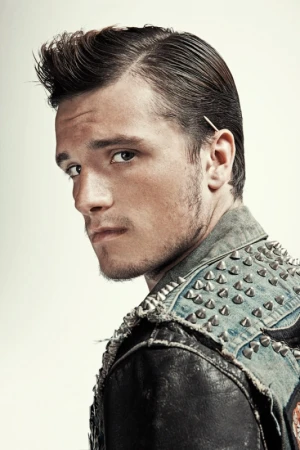 Portrait of Josh Hutcherson wearing a black studded leather jacket against a neutral studio background