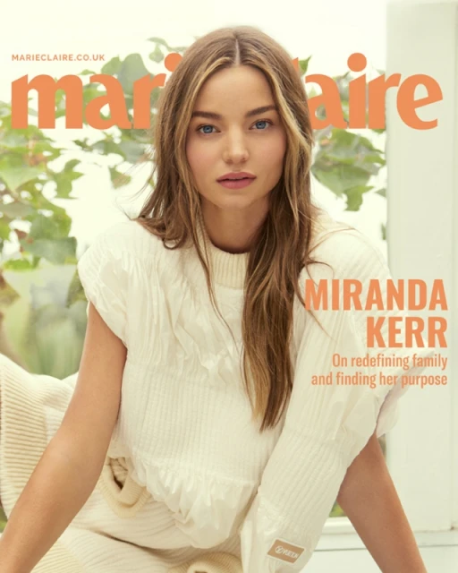Magazine cover featuring Miranda Kerr in cream knitwear, soft lighting, and a leafy outdoor background with the Marie Claire logo.