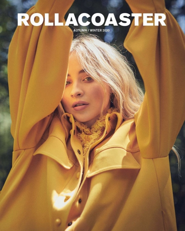 Portrait of a blonde woman wearing a mustard-yellow jacket with a lace top for the cover of Rollacoaster Magazine Autumn/Winter 2020.