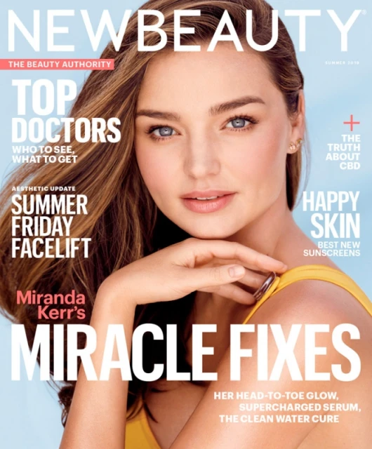 Magazine cover featuring Miranda Kerr with 'NewBeauty' branding and headlines about skincare, doctors, and aesthetic treatments.