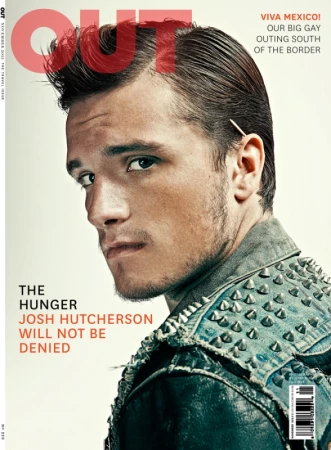 Josh Hutcherson poses on the cover of Out Magazine wearing a studded jacket against a light background in a close-up studio shot.