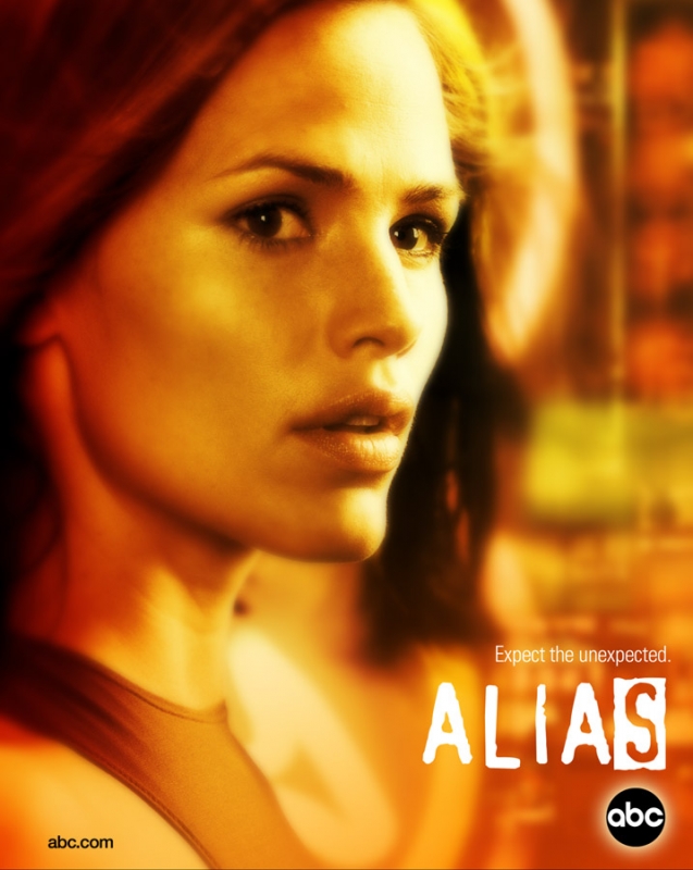 Close-up of a woman in warm lighting with the text "ALIAS" and the ABC logo visible, possibly a promotional image for the television show.