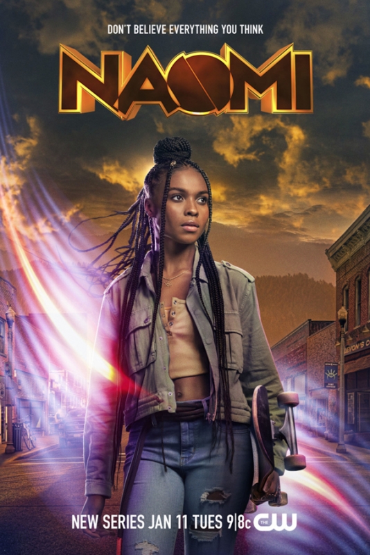 Young Black woman holding a skateboard on a street at sunset with glowing light streaks