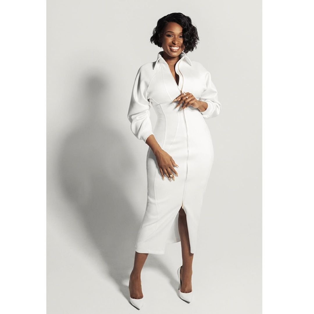 Jennifer Hudson in a white midi dress with long sleeves against a seamless white studio background
