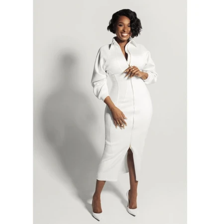 Jennifer Hudson in a white midi dress with long sleeves against a seamless white studio background