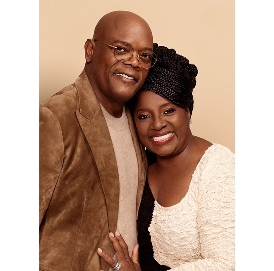 A smiling Samuel L. Jackson and LaTanya Richardson Jackson pose together in a medium shot, showcasing their elegant attire and warm expressions.