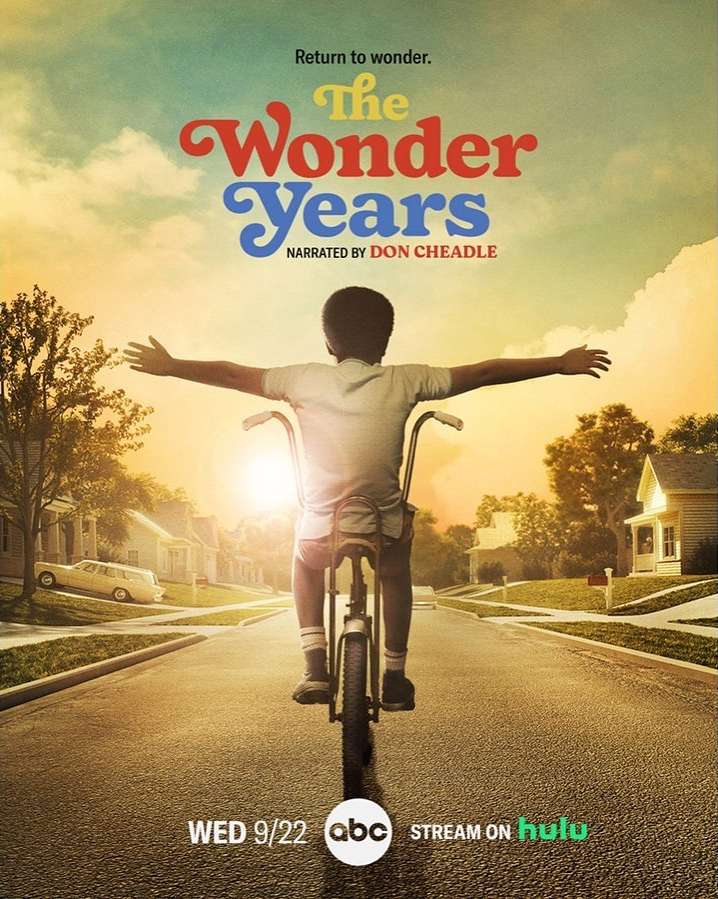 TV show poster: a child rides a bike on a street with houses under a sky with a show title, 'The Wonder Years'.