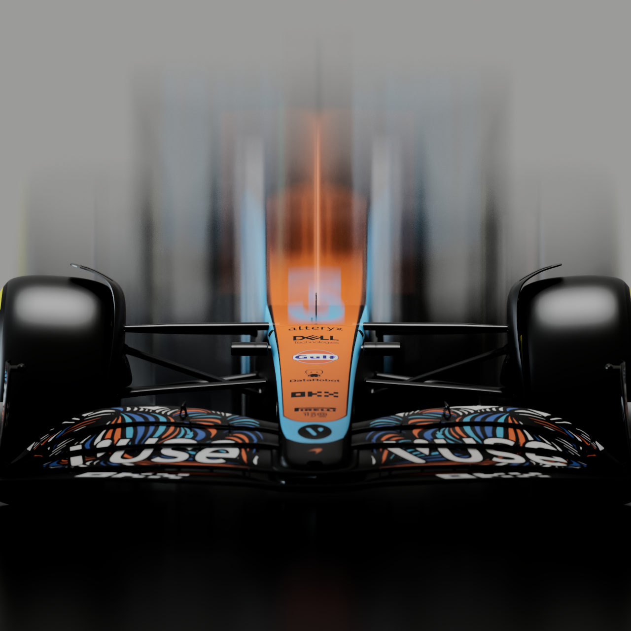 Close-up of a Formula One race car with a sharp focus on its front wing and body, displaying sponsor logos and vibrant orange and blue colors.