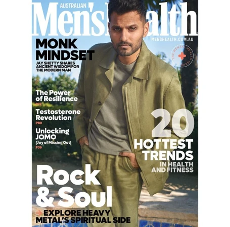 Jay Shetty on the cover of Australian Men's Health magazine wearing an olive green linen suit. Magazine displays health and fitness themes.