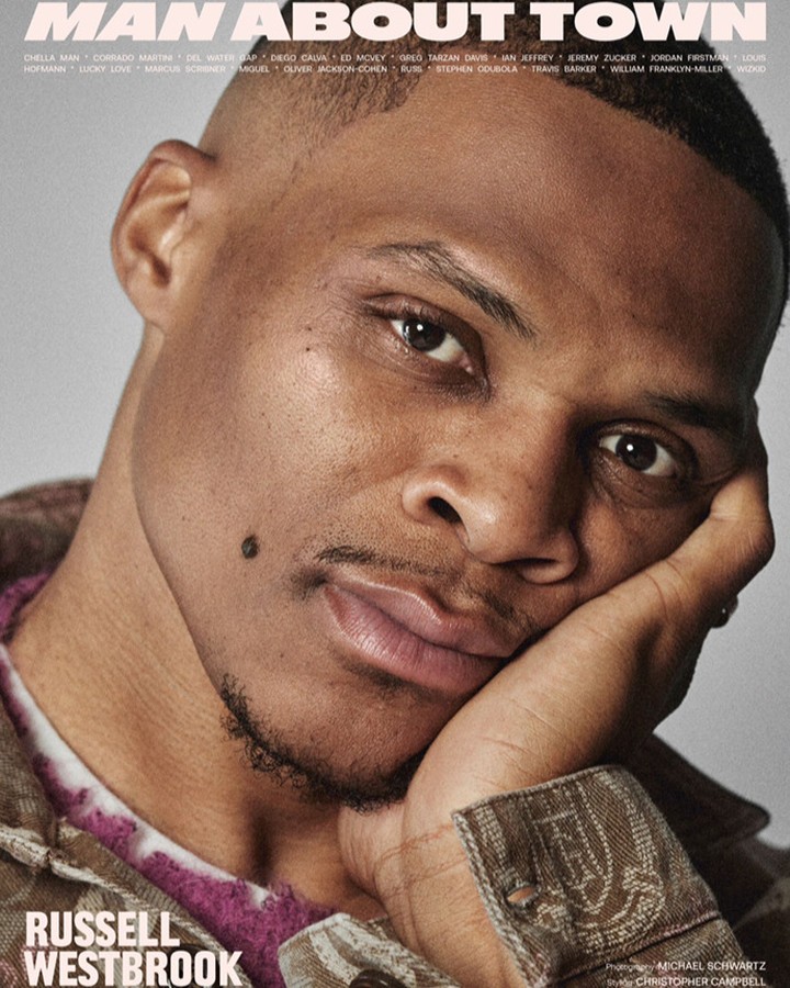 Close-up magazine cover featuring Russell Westbrook in a casual brown jacket with short hair, resting his face on his hand.