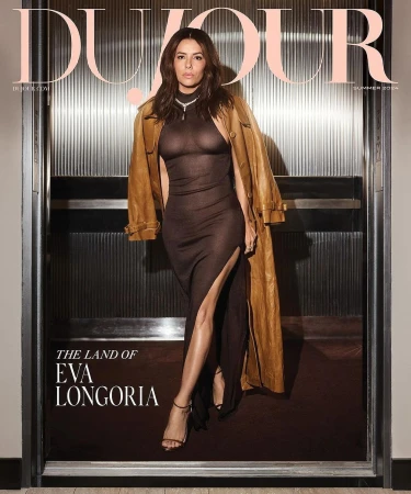 Eva Longoria graces the cover of Dujour Magazine Summer 2024, posing in a brown dress and trench coat, set against a metal backdrop.