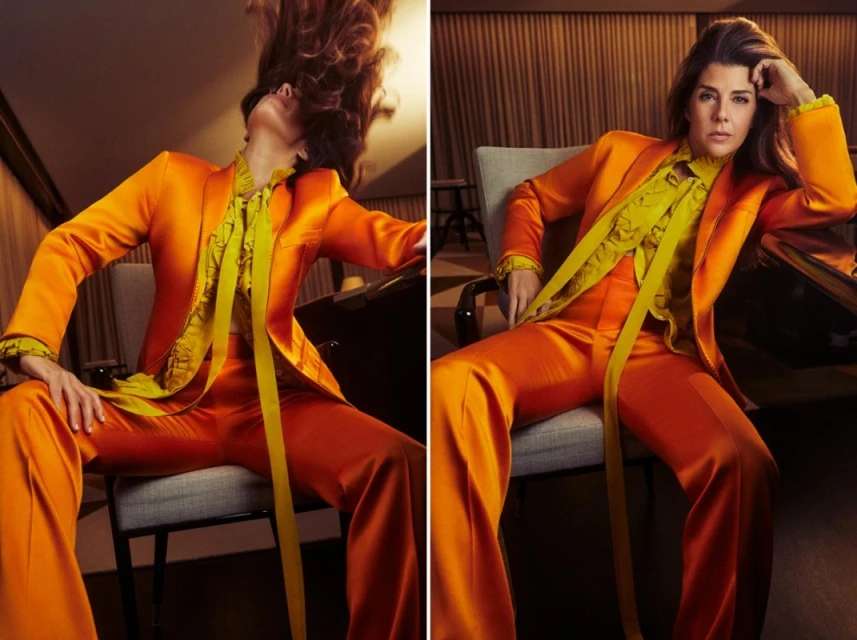 Two images of a woman in an orange pantsuit and a yellow blouse striking different poses in what appears to be a room.