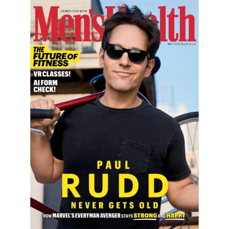Men's Health cover featuring Paul Rudd in sunglasses and a black t-shirt with a bike slung over his shoulder. Fitness and health theme.