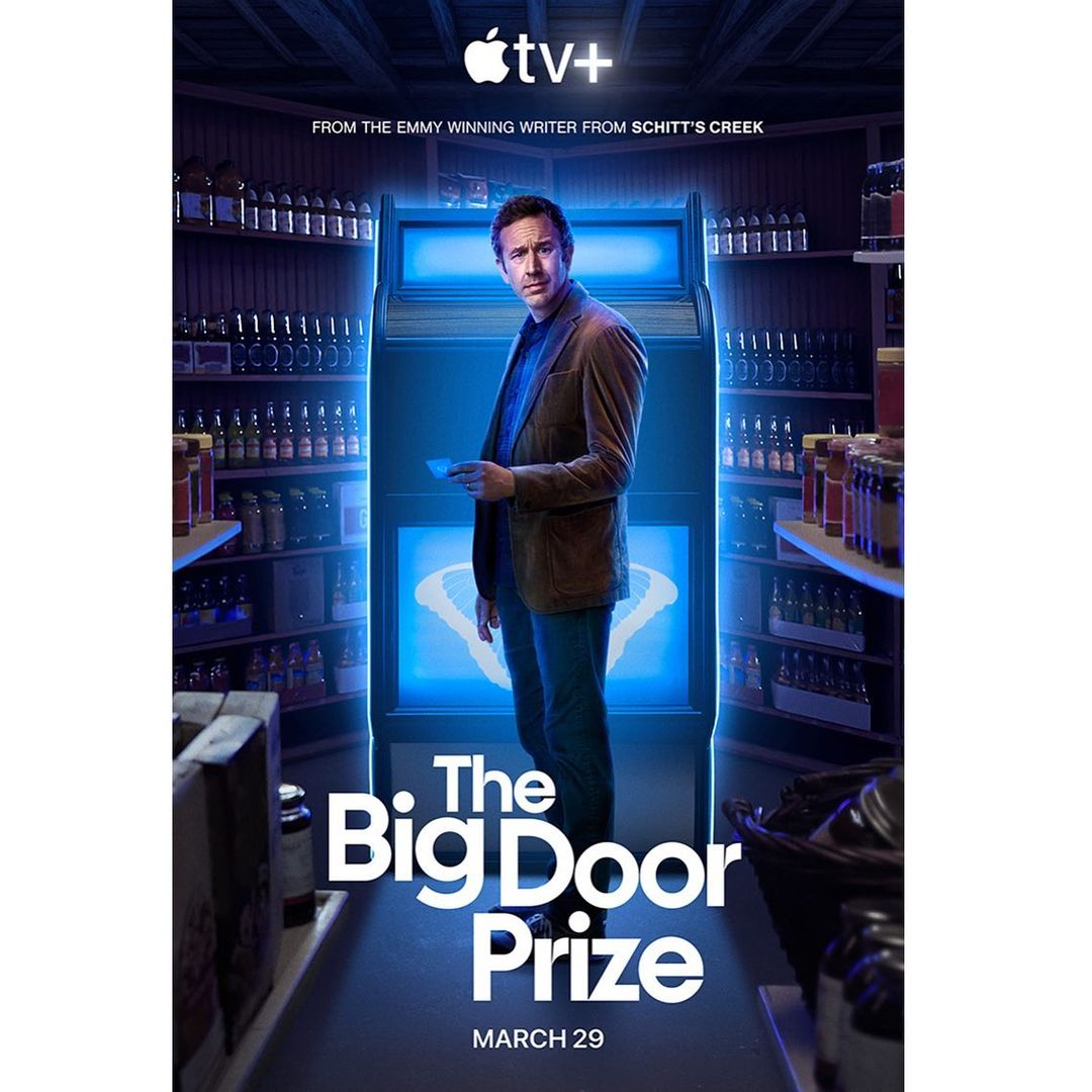 Movie poster for The Big Door Prize featuring a man standing in front of a glowing blue machine surrounded by shelves of jars.