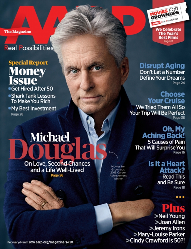 AARP magazine cover featuring a headshot of Michael Douglas wearing a navy blazer, with article headlines visible in the background.