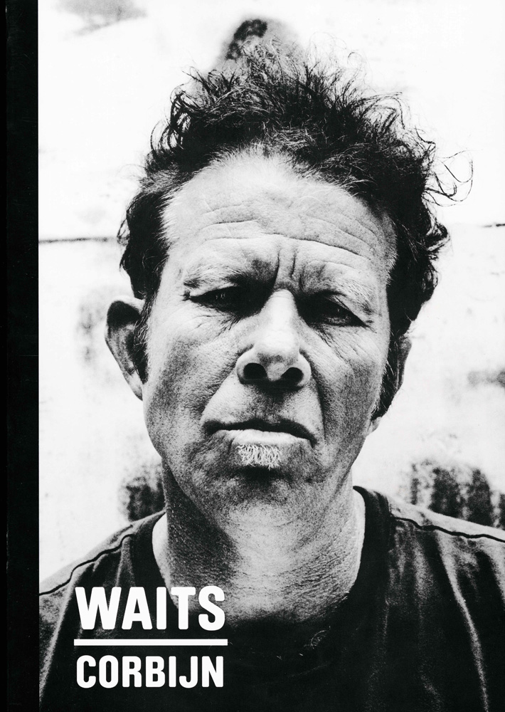 Black and white portrait of adult male with short curly hair looking forward. Text WAITS CORBIJN is at the bottom of the frame.