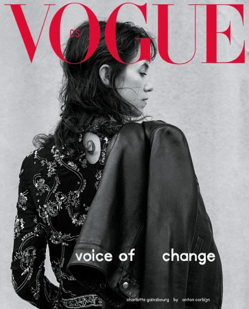 Vogue magazine cover featuring Charlotte Gainsbourg in embellished jacket, glancing to the side, with black leather jacket draped over shoulder.