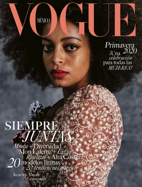 Vogue Mexico cover featuring a Black female model with an afro wearing a lace top with a floral design and bold red lipstick.