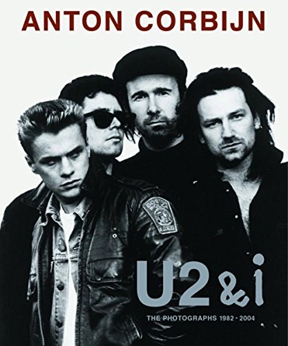 Black and white image of the rock band U2 on the cover of a book by Anton Corbijn, featuring four men in leather jackets.