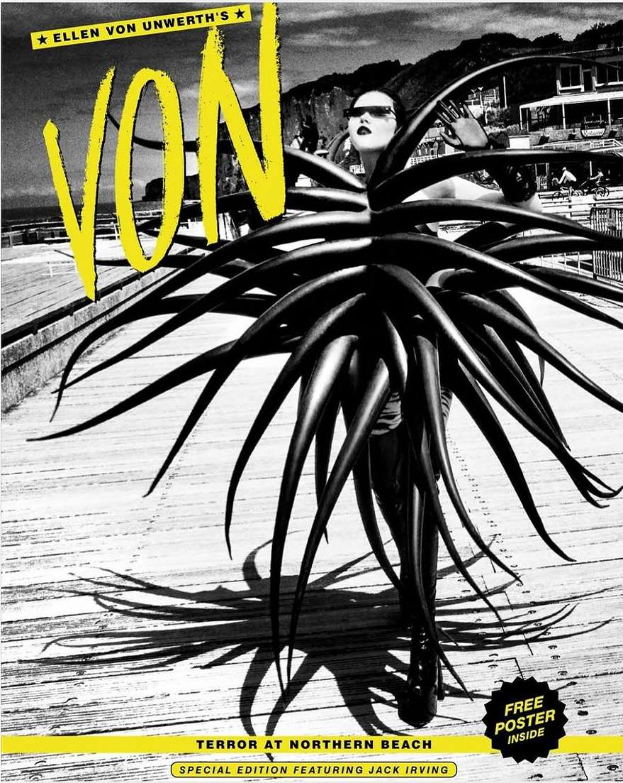 Monochrome magazine cover with a stylish woman in sunglasses surrounded by spiky foliage, featuring bold yellow text and beach setting.