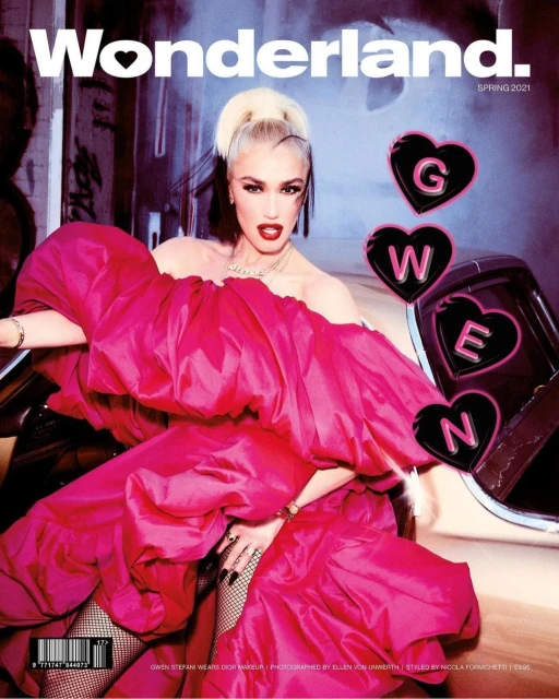 Gwen Stefani on Wonderland. magazine cover, Spring 2021 issue, wearing a pink dress with puffed sleeves and posed inside of a car.