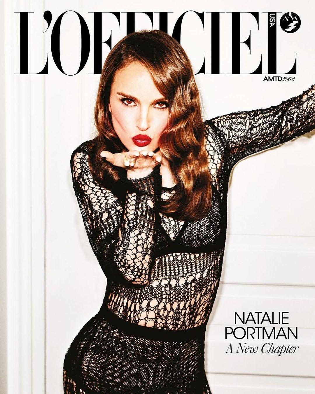 Magazine cover featuring Natalie Portman blowing a kiss, wearing a black lace dress and bold red lipstick, against a white background.