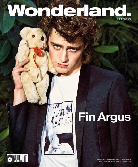 Wonderland Summer 2021 magazine cover featuring a male model in a blazer holding a teddy bear against a foliage background.
