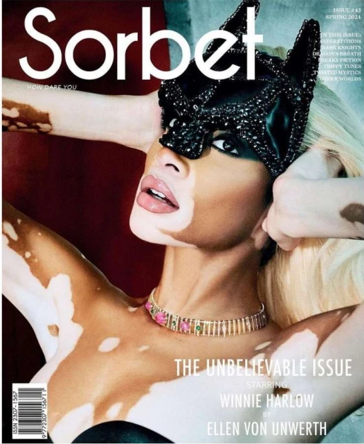 Winnie Harlow on the cover of Sorbet magazine wearing a black beaded mask and gold choker. The issue is The Unbelievable Issue.