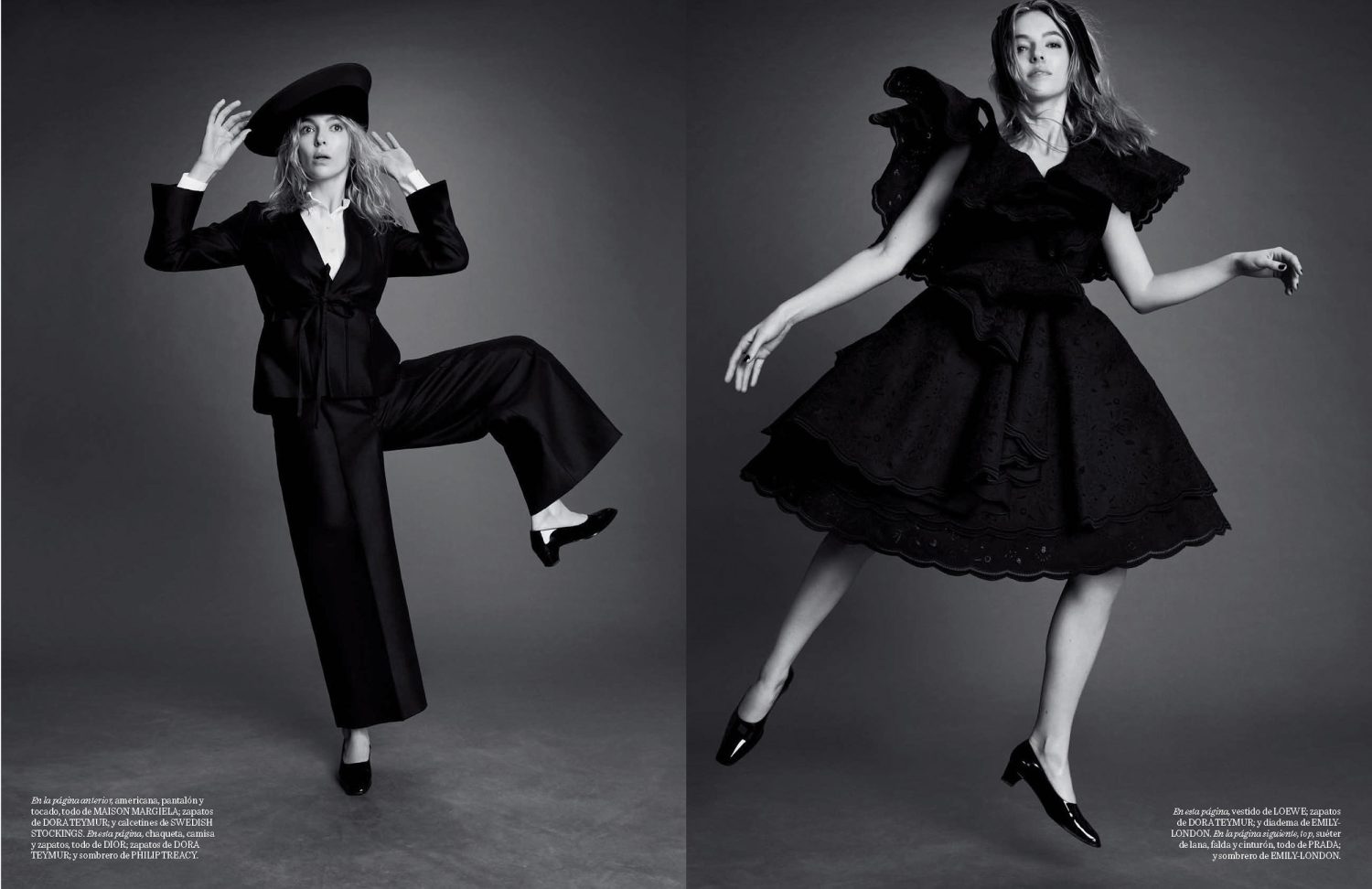 Two women in black dresses and hats pose against a grey backdrop in a monochrome fashion photograph for a magazine spread.