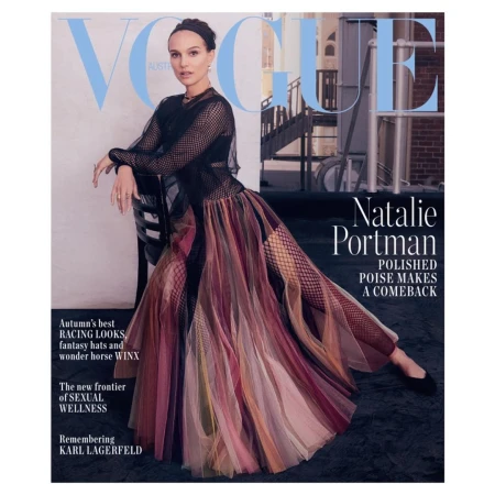 Vogue Australia magazine cover featuring Natalie Portman in black mesh top and multicolored skirt against a rooftop backdrop.