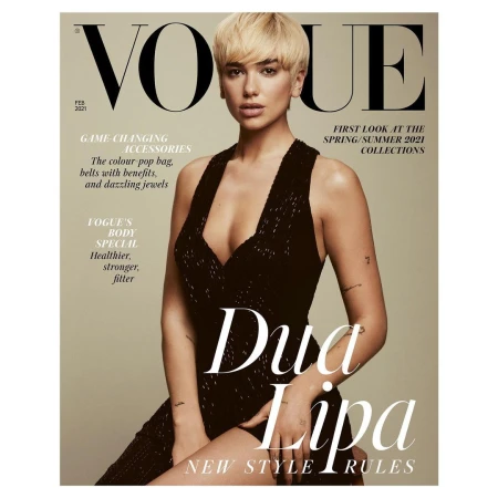 Vogue cover featuring Dua Lipa with short blonde hair wearing a dark dress, posing against a beige background, with magazine text.