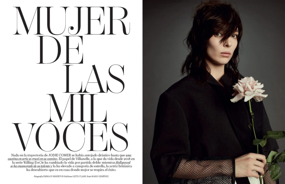 Fashion editorial portrait of a brunette woman in a black jacket holding a pale pink rose against a grey background with text overlay.