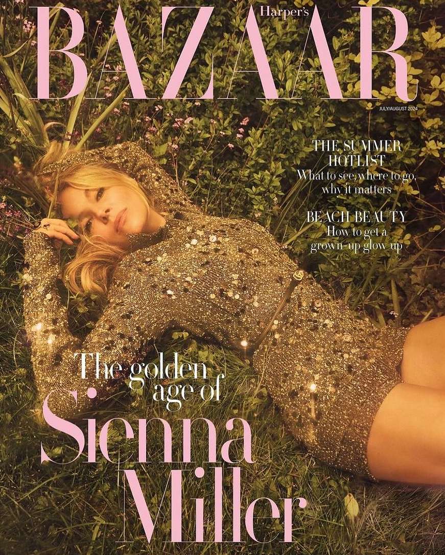 Sienna Miller lying in a garden wearing a gold sequin hooded mini dress on a magazine cover shot by Emma Summerton