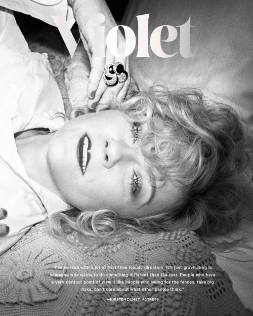 Black and white portrait of Kirsten Dunst lying down, with text overlay and focus on her face and an ornate ring.