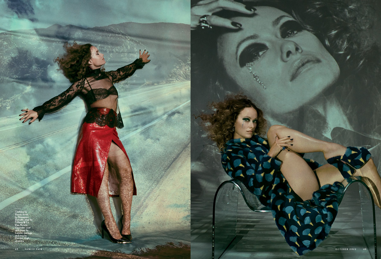 Fashion editorial shot featuring a woman in a black lace top and red skirt lying against a backdrop, and a woman in a blue dress seated.