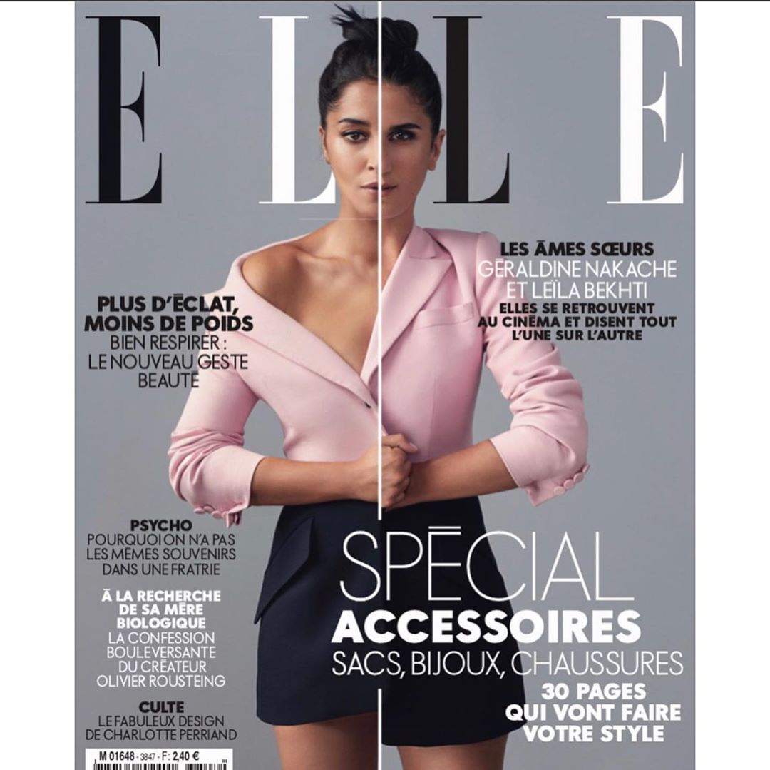 Elle magazine cover featuring an adult woman in a pink blazer and navy skirt against a grey background with magazine text.
