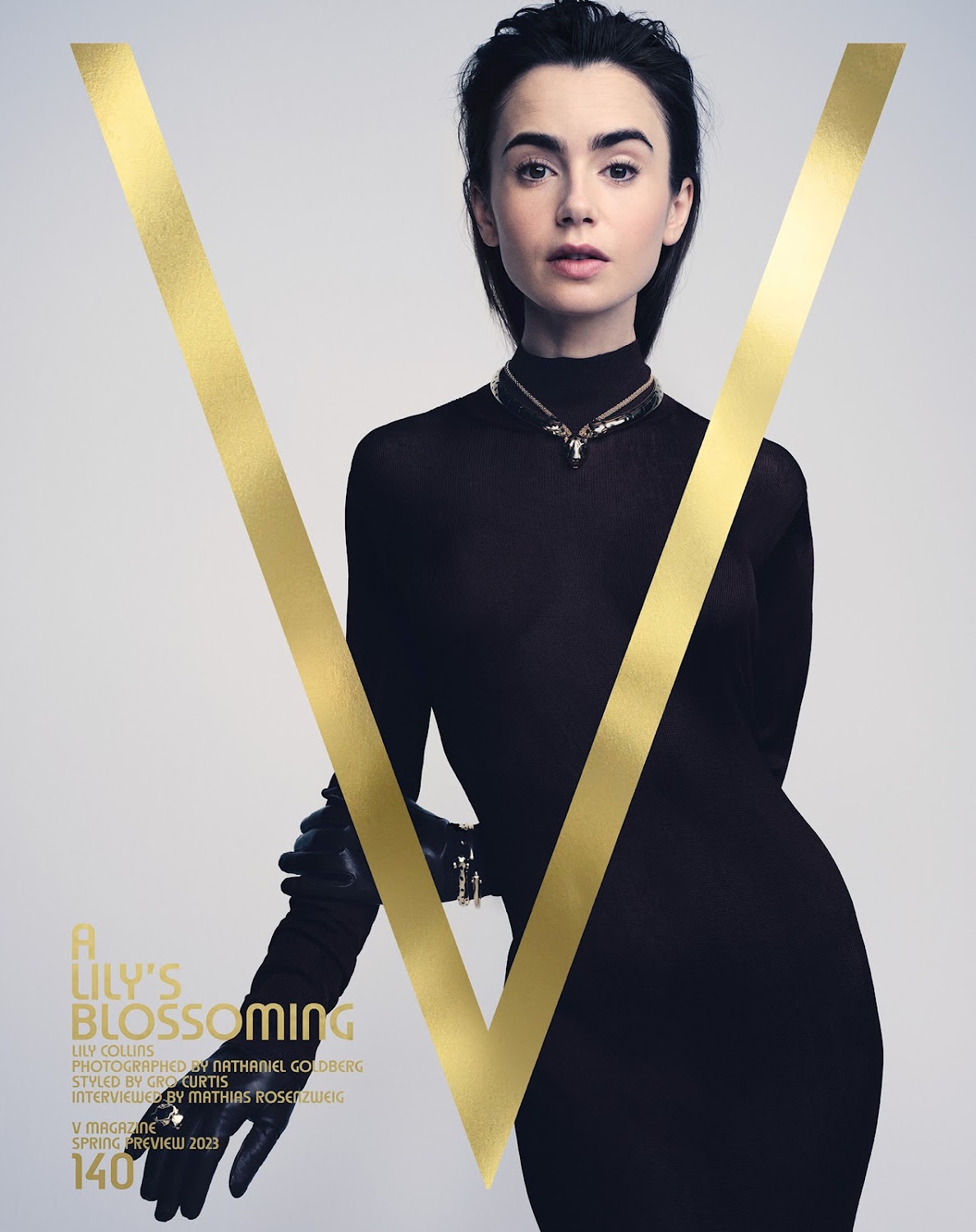 Fashion magazine cover featuring a woman in a black turtleneck dress with gold accents, embodying elegance and style.