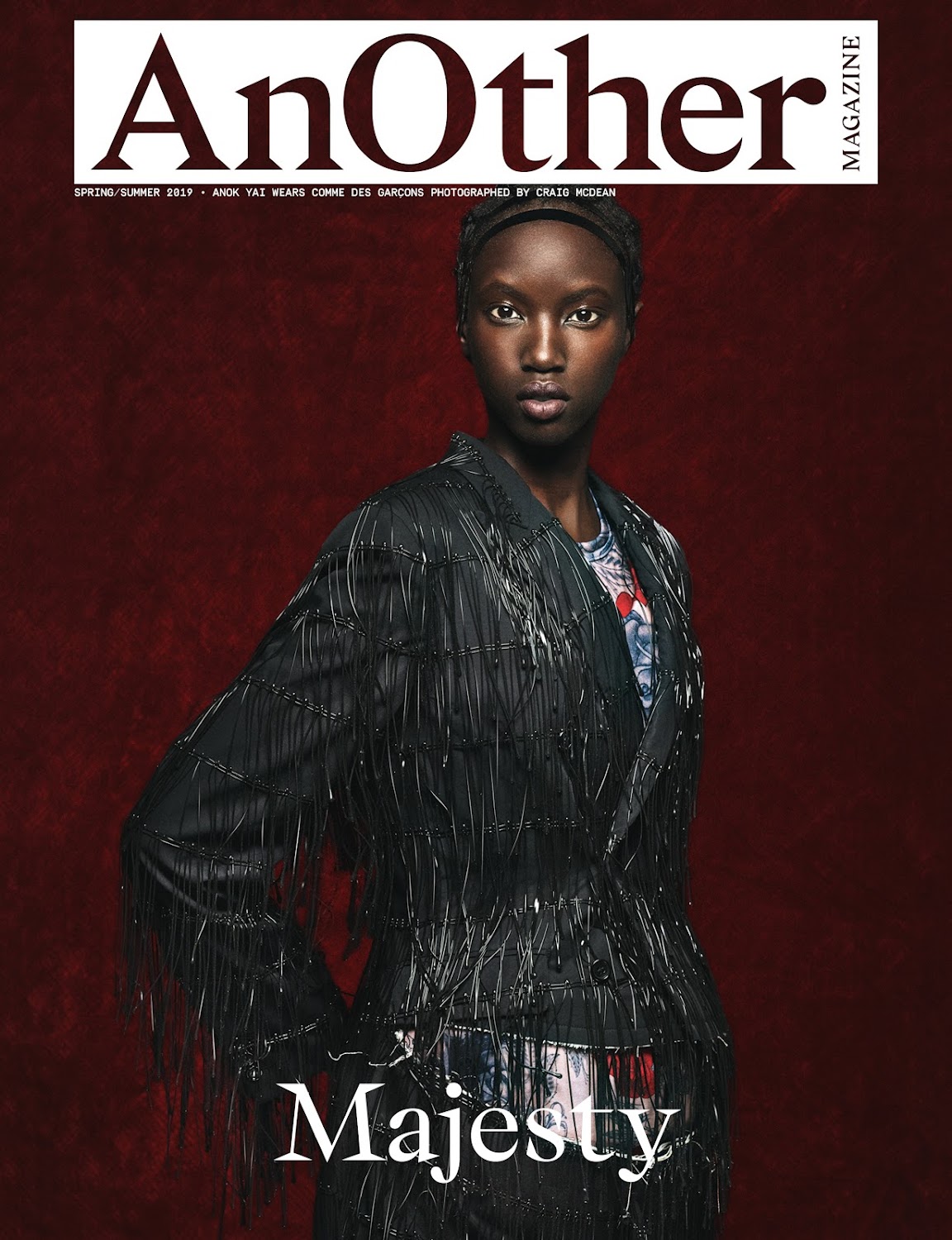 Magazine cover featuring an African-American woman in an embellished black jacket against a dark red background. 'Majesty' is written below.