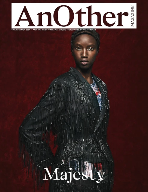 Magazine cover featuring an African-American woman in an embellished black jacket against a dark red background. 'Majesty' is written below.