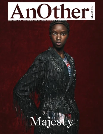 Magazine cover featuring an African-American woman in an embellished black jacket against a dark red background. 'Majesty' is written below.