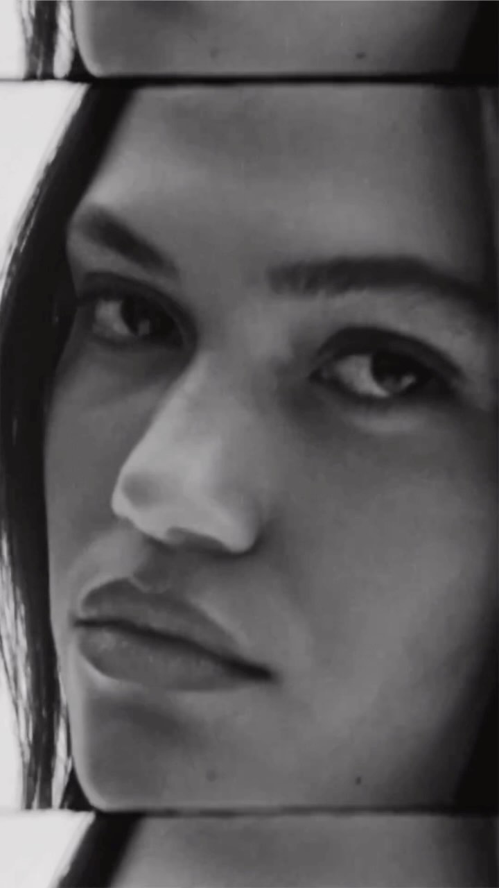 Close-up portrait of a woman in monochrome, featuring multiple vertically layered crop frames focusing on her face.