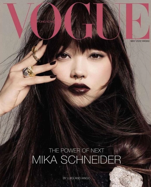 Vogue Hong Kong cover featuring model Mika Schneider with dark hair, wearing dark lipstick, and silver rings, May 2022 issue.